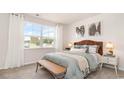 Cozy bedroom with a green duvet, wicker headboard and side table at 179 Calm Dr., Little River, SC 29566