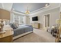 Spacious main bedroom with large bed, TV, and neutral decor at 301 Climbing Vine Ct., Conway, SC 29526