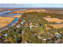 Sprawling property with mature trees and landscaping near the Waccamaw River at 356 Rossdhu Ave., Pawleys Island, SC 29585