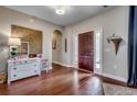 Inviting foyer with hardwood floors, elegant decor, and a stylish front door with sidelights at 8605 Hopper Ct., Myrtle Beach, SC 29579