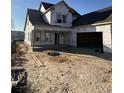 New home construction featuring an attached two-car garage and a covered porch at 1020 Clamour Ct., Conway, SC 29526