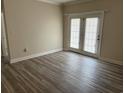 Living room with hardwood floors and French doors at 2013 Silvercrest Dr. # 30-A, Myrtle Beach, SC 29579