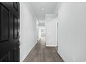 Bright and spacious entryway with dark-stained hardwood floors at 2040 Copper Creek Loop, Longs, SC 29568