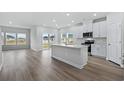 Modern kitchen featuring white cabinets, quartz countertops, and stainless steel appliances at 2040 Copper Creek Loop, Longs, SC 29568