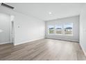 Spacious living room with large windows and hardwood floors at 2040 Copper Creek Loop, Longs, SC 29568