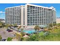 High-rise building with pool and parking area at 205 74Th Ave. N # 1601, Myrtle Beach, SC 29572