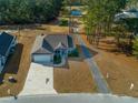 House with driveway and backyard near golf course at 363 Long Meadow Dr., Loris, SC 29569