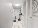 Hallway with white cabinets and tile floor leading to kitchen at 400 20Th Ave. N # 303, Myrtle Beach, SC 29577