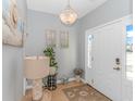 Bright and airy entryway with coastal decor and tile flooring at 451 Cypress View Ave., Little River, SC 29566
