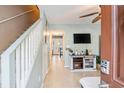 Inviting entryway with staircase, ceiling fan, and convenient access to the living space at 6706 Bryant St. # B, Myrtle Beach, SC 29572