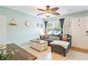 Comfortable living area with ceiling fan, tile floors, and a neutral color palette at 6706 Bryant St. # B, Myrtle Beach, SC 29572