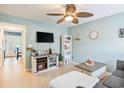 Cozy living room featuring a ceiling fan, stylish furniture, and tiled floors at 6706 Bryant St. # B, Myrtle Beach, SC 29572