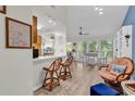 Bright living space with dining area, hardwood floors, and a view of the trees outside at 859 Tall Oaks Ct. # A, Myrtle Beach, SC 29588