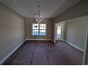Elegant dining room with large window and chandelier at Tbd 18 Casey Dr., Nichols, SC 29581