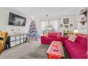 Living room features a Christmas tree and red couches at 1025 Carolina Rd. # Z4, Conway, SC 29526