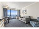 Living room with ocean view and balcony access at 1105 S Ocean Blvd. # 620, Myrtle Beach, SC 29577