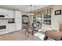 Bright kitchen with breakfast nook and backyard view at 130 Balsa Dr., Longs, SC 29568