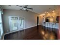 Spacious living room with beautiful hardwood floors and sliding glass doors at 135 Parmelee Dr. # D, Murrells Inlet, SC 29576