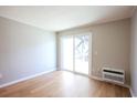 Light-filled living area with hardwood floors and access to a balcony at 300 47Th Ave. S # 1C, North Myrtle Beach, SC 29582