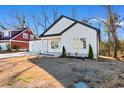 Newly built home with white siding, two-car garage, and front yard at 306 Rivers Edge Dr., Conway, SC 29526