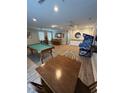 Spacious game room with a pool table, bar area, and vintage arcade game at 5300 Ocean Blvd. N, North Myrtle Beach, SC 29582