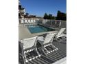 Relaxing outdoor pool area with lounge chairs and a white picket fence surround at 5300 Ocean Blvd. N, North Myrtle Beach, SC 29582