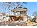 Stylish coastal home with dark gray siding and spacious deck at 6001 - 1450 S Kings Hwy., Myrtle Beach, SC 29575