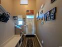 Bright entryway with staircase, bench, and coat rack at 740 Hackberry Way, Longs, SC 29568