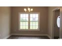 Dining room with large windows and chandelier at Tbd 9 Woodlawn Dr., Loris, SC 29569
