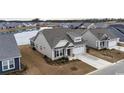 Two-story house with a lake view in a new development community at 1262 Witch Hazel Way, Longs, SC 29568