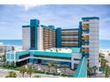 Stunning exterior view of Landmark Resort, showcasing oceanfront views, covered walkway, and front parking at 1501 S Ocean Blvd. # 1442, Myrtle Beach, SC 29577