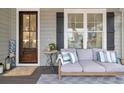 Inviting front porch with comfortable seating and wooden details at 22 Trigger Fish Ln., Murrells Inlet, SC 29576