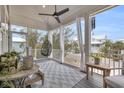 Relaxing screened porch with comfortable seating and neighborhood view at 22 Trigger Fish Ln., Murrells Inlet, SC 29576