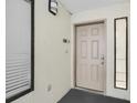 Beige door, neutral-colored walls, small window on each side at 4619 S Ocean Blvd. # 207, North Myrtle Beach, SC 29582