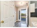 Interior entryway with open door to a balcony and adjacent to kitchen at 4650 Lightkeepers Way # 21D, Little River, SC 29566