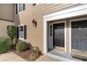 Two black doors with gold accents at the entrance of a tan building at 501 44Th Ave. N # D-3, Myrtle Beach, SC 29577
