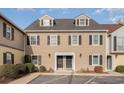 Tan colored two-story building with multiple units and parking at 501 44Th Ave. N # D-3, Myrtle Beach, SC 29577