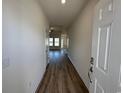 Inviting entryway featuring wood-look flooring and views into the spacious living area at 541 Honeyhill Loop, Conway, SC 29526