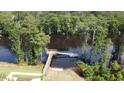 Private dock with boardwalk access to a calm river, perfect for kayaking and fishing at 576 Honeyhill Loop, Conway, SC 29526