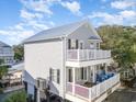 Two-story home with multiple decks and gray siding at 6001-1041 S Kings Hwy., Myrtle Beach, SC 29575