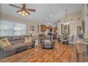 Open living room with hardwood floors, comfy seating, and kitchen view at 6001-1909 S Kings Hwy., Myrtle Beach, SC 29575