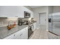 Kitchen with stainless steel appliances and granite countertops at 70 Addison Cottage Way # 319, Murrells Inlet, SC 29576