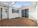 Brick patio with pergola, offering a peaceful outdoor space at 703 Gleneagles Dr., Myrtle Beach, SC 29588