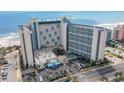 Beautiful aerial view of the resort featuring a refreshing pool and easy beach access at 7100 Ocean Blvd. # 223, Myrtle Beach, SC 29572