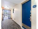 Well-lit hallway showing unit entry door and exit access at 7100 Ocean Blvd. # 223, Myrtle Beach, SC 29572