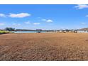 Spacious backyard with a lake view and pergola at 747 Coquina Bay Dr., Conway, SC 29526