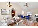 Open concept living room with dining area, stylish furnishings, and a view of the kitchen at 817 Payne Ct., Conway, SC 29526