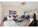 Bright, modern living room with high ceilings, stylish furniture, an eye-catching rug, and a view into the dining area at 817 Payne Ct., Conway, SC 29526