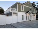 This home features a charming second story patio in addition to a lovely white picket fence at 931 Edge Dr., North Myrtle Beach, SC 29582