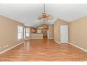 Bright living room with hardwood floors, vaulted ceiling and ceiling fan at 204 Atoll Dr., Myrtle Beach, SC 29588